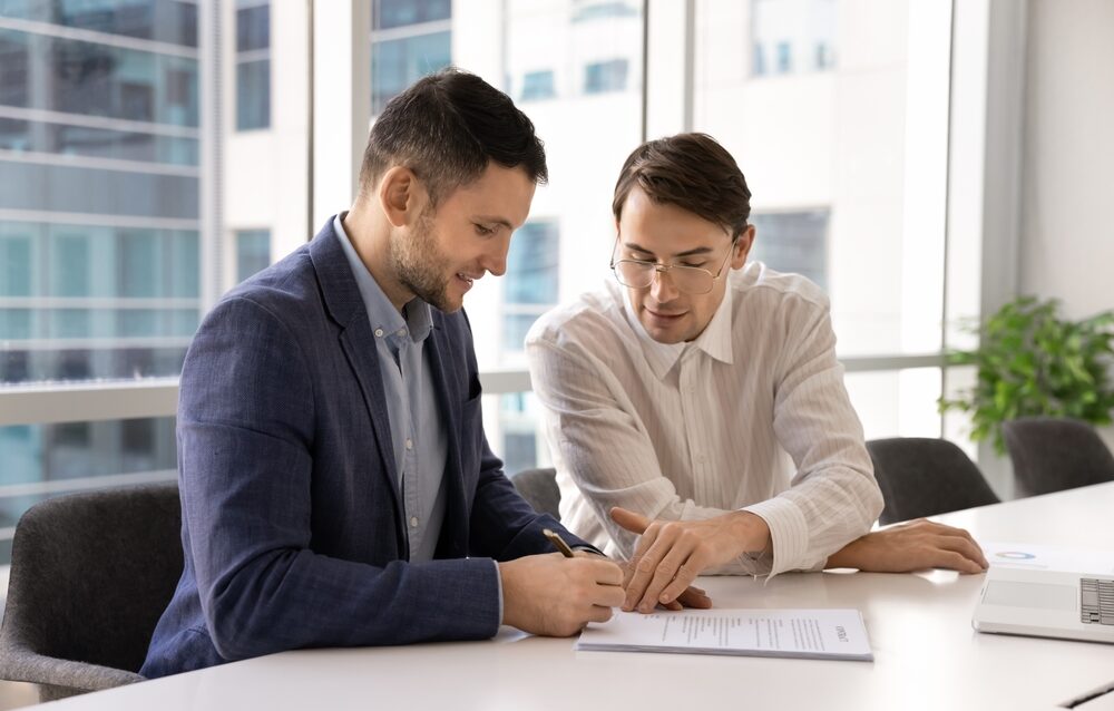 Business,Expert,Man,Pointing,At,Place,For,Signature,In,Contract